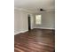 Bright living room with wood flooring and a ceiling fan, showcasing neutral paint at 2245 Polar Rock Sw Ave, Atlanta, GA 30315