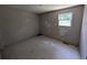 Empty bedroom with a window, ready for new decor and personal touch at 446 Westbrook Rd, Carrollton, GA 30116