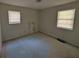 Bedroom with two windows ready for new flooring and personalized updates at 446 Westbrook Rd, Carrollton, GA 30116
