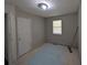 Bedroom with window and overhead lighting awaits your personal design touch at 446 Westbrook Rd, Carrollton, GA 30116