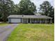 Charming single-story home with a covered front porch and attached garage at 446 Westbrook Rd, Carrollton, GA 30116