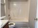The bathroom features a shower/tub combo and neutral colors at 5465 Twin Lakes Dr, College Park, GA 30349