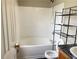 Bathroom with shower/tub combo and storage shelving at 5465 Twin Lakes Dr, College Park, GA 30349
