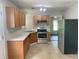 Well-lit kitchen featuring stainless steel appliances, lots of cabinet space, and an open layout at 5465 Twin Lakes Dr, College Park, GA 30349