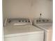 The laundry room includes a Whirlpool washer and dryer at 5465 Twin Lakes Dr, College Park, GA 30349