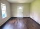 This room features wood floors and a door to the front at 5465 Twin Lakes Dr, College Park, GA 30349