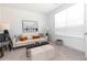 Bright living room with a neutral color palette, modern furnishings, and ample natural light at 621 Silva St # 124, Cumming, GA 30040