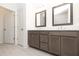 Stylish bathroom featuring double sink vanity, modern fixtures, and tile flooring at 629 Silva St # 128, Cumming, GA 30040