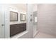 Beautiful bathroom featuring double sinks and vanities and a luxurious shower at 629 Silva St # 128, Cumming, GA 30040