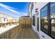 Private wooden deck and windows overlook neighboring homes with drive under garages at 629 Silva St # 128, Cumming, GA 30040