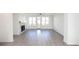 Bright living room with stone fireplace, lots of natural light, and hardwood floors at 629 Silva St # 128, Cumming, GA 30040