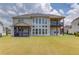 Rear exterior view of home featuring a screened-in porch and a deck at 4035 Starwood Dr, Cumming, GA 30028