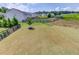 View of the spacious backyard featuring a black fence, grassy lawn, and some landscaping at 4035 Starwood Dr, Cumming, GA 30028