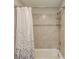 Bathroom featuring a tile shower surround and a white shower curtain at 4035 Starwood Dr, Cumming, GA 30028
