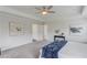Primary bedroom with tray ceiling, plush carpet, and modern decor at 4035 Starwood Dr, Cumming, GA 30028
