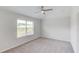 Bedroom featuring neutral carpet, a ceiling fan, and a window at 4035 Starwood Dr, Cumming, GA 30028