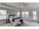 Well-lit bedroom with large windows and ceiling fan at 4035 Starwood Dr, Cumming, GA 30028