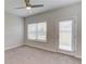 Light bedroom with a ceiling fan, and access to the outdoors through a glass door at 4035 Starwood Dr, Cumming, GA 30028