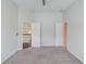 Bedroom featuring neutral carpet, a ceiling fan, and two doorways at 4035 Starwood Dr, Cumming, GA 30028