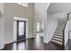 Grand foyer with high ceilings, hardwood floors, and a staircase at 4035 Starwood Dr, Cumming, GA 30028