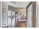 Inviting foyer with gleaming hardwood floors, high ceilings, and a view into the living and dining areas at 4035 Starwood Dr, Cumming, GA 30028