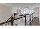 Upstairs hallway overlooking the living room with coffered ceiling at 4035 Starwood Dr, Cumming, GA 30028