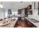 Modern kitchen with granite counters, stainless appliances, and a large island at 4035 Starwood Dr, Cumming, GA 30028