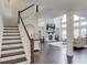 Inviting living room with fireplace, hardwood floors, and two-story windows at 4035 Starwood Dr, Cumming, GA 30028