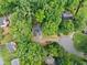 Aerial view of a home situated on a well-manicured lot surrounded by mature trees at 4528 Lashley Ne Ct, Marietta, GA 30068