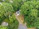 An aerial view of a home nestled among lush, mature trees on a large lot at 4528 Lashley Ne Ct, Marietta, GA 30068