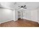 Spacious bedroom with wood floors, a ceiling fan, and a closet connected to an ensuite bathroom at 4528 Lashley Ne Ct, Marietta, GA 30068