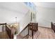 Bright foyer with hardwood floors, a staircase with wood railing, and lots of natural light from large windows at 4528 Lashley Ne Ct, Marietta, GA 30068
