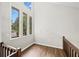 Sun-filled foyer featuring hardwood floors, wood railings, and large windows overlooking the front yard at 4528 Lashley Ne Ct, Marietta, GA 30068