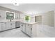 Bright, remodeled kitchen featuring white cabinets, marble countertops, and modern appliances at 4528 Lashley Ne Ct, Marietta, GA 30068