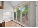 Bright and modern living area with large windows overlooking lush greenery and wood floors at 4528 Lashley Ne Ct, Marietta, GA 30068