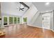 Light filled living room with a stone fireplace and open layout that connects to a kitchen at 4528 Lashley Ne Ct, Marietta, GA 30068
