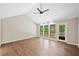 Bright living room boasts vaulted ceiling, fan, and large windows offering natural light and inviting atmosphere at 4528 Lashley Ne Ct, Marietta, GA 30068