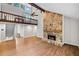 Spacious living room with stone fireplace, open to the second story, and hardwood flooring at 4528 Lashley Ne Ct, Marietta, GA 30068