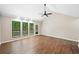 Bright living room boasts vaulted ceiling, fan, and large windows offering natural light and inviting atmosphere at 4528 Lashley Ne Ct, Marietta, GA 30068