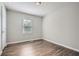 A well-lit bedroom with neutral walls and modern wood-look floors at 520 White Pines Dr, Dallas, GA 30157