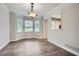 Dining room with luxury vinyl plank flooring, neutral paint, and many windows at 520 White Pines Dr, Dallas, GA 30157