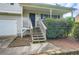 Inviting front entrance with a covered porch, stairs, and a two-car garage at 520 White Pines Dr, Dallas, GA 30157