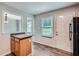 A cozy eat-in kitchen featuring a breakfast bar, stainless appliances, and a connection to other rooms at 520 White Pines Dr, Dallas, GA 30157