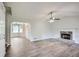 Spacious living room with luxury vinyl plank flooring, fireplace and large windows at 520 White Pines Dr, Dallas, GA 30157