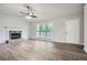 Bright living room featuring luxury vinyl plank flooring, fireplace and large windows at 520 White Pines Dr, Dallas, GA 30157