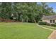 Expansive backyard featuring a basketball court, playset, and lush green grass, great for outdoor activities at 5349 Forest Springs Dr, Dunwoody, GA 30338