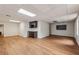 Spacious finished basement with wood laminate flooring, a wet bar, and recessed lighting, perfect for entertaining at 5349 Forest Springs Dr, Dunwoody, GA 30338