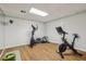 Basement exercise room featuring a spin bike, elliptical, and workout mat, creating a perfect fitness space at 5349 Forest Springs Dr, Dunwoody, GA 30338