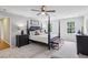 Spacious bedroom with four poster bed, carpet flooring and bench seating at the end of the bed at 5349 Forest Springs Dr, Dunwoody, GA 30338