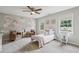Comfortable bedroom with a floral wall design, two windows and chair seating at 5349 Forest Springs Dr, Dunwoody, GA 30338
